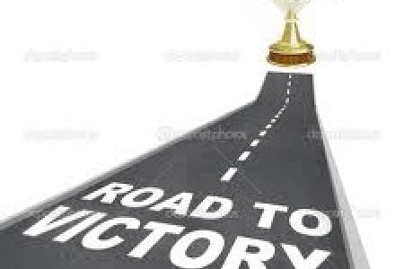 Trophy on road with the words 'Road to Victory'